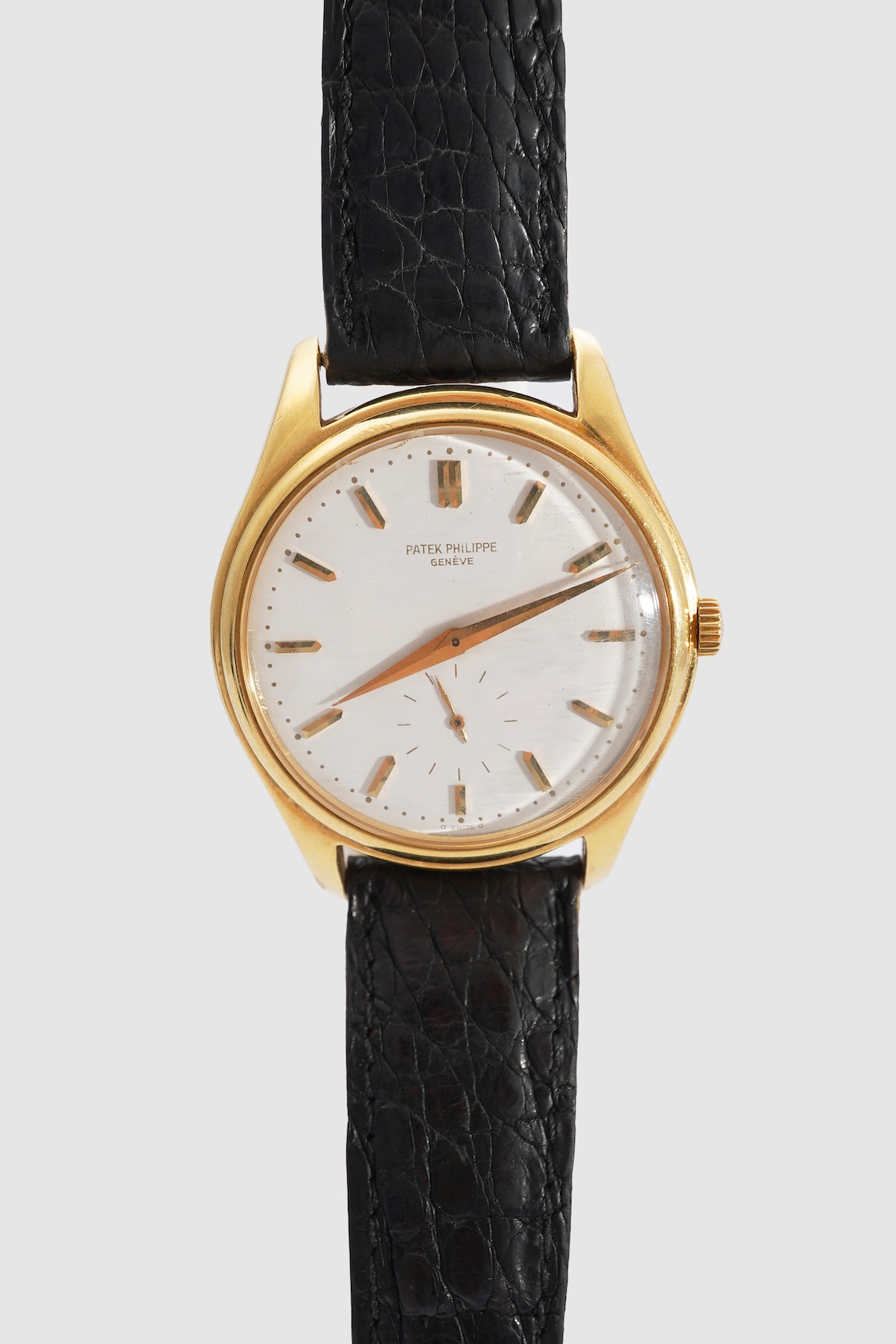 A gentleman's fine 18ct gold Patek Philippe Calatrava automatic wrist watch, model number 2526, on a Patek Philippe black leather strap with a Patek Philippe 18ct gold buckle